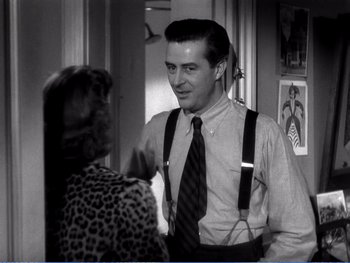 Movie still from “The Lost Weekend” (1945), directed by Billy Wilder – A black and white photo of a man and a woman talking; Medium shot, Over the shoulder angle