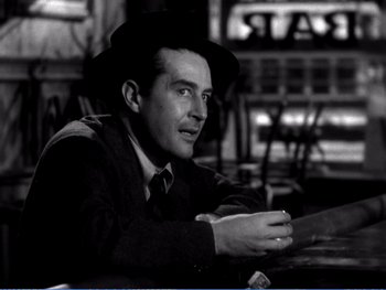 Movie still from “The Lost Weekend” (1945), directed by Billy Wilder – A black and white photo of a man wearing a hat; Close Up shot, Over the shoulder angle