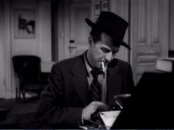 Movie still from “The Lost Weekend” (1945), directed by Billy Wilder – A black and white photo of a man smoking a cigarette; Close Up shot, High angle