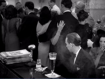 Movie still from “The Lost Weekend” (1945), directed by Billy Wilder – A black - and - white photo of a man and a woman; Wide shot, High angle