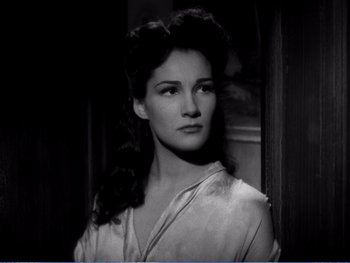 Movie still from “The Lost Weekend” (1945), directed by Billy Wilder – A black - and - white photo of a woman in a white shirt; Close Up shot, High angle