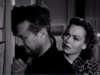 Movie still from “The Lost Weekend” (1945), directed by Billy Wilder – A man and a woman standing next to each other; Close Up shot, Over the shoulder angle