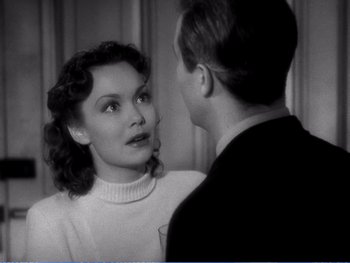 Movie still from “The Lost Weekend” (1945), directed by Billy Wilder – An old photo of a man and a woman talking to each other; Close Up shot, Over the shoulder angle