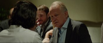 Movie still from “The Man Who Killed Don Quixote” (2018), directed by Terry Gilliam – A group of men sitting around a table; Close Up shot, Over the shoulder angle