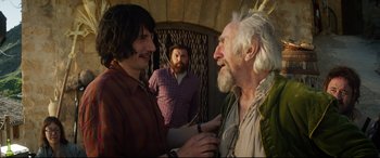 Movie still from “The Man Who Killed Don Quixote” (2018), directed by Terry Gilliam – Two men and an old man talking to each other; Medium shot, Over the shoulder angle