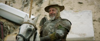 Movie still from “The Man Who Killed Don Quixote” (2018), directed by Terry Gilliam – A man dressed as a medieval knight on a horse; Medium shot, Low angle