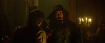 Movie still from “The Man Who Killed Don Quixote” (2018), directed by Terry Gilliam – A man in a pirate costume talking to another man; Medium shot, Over the shoulder angle
