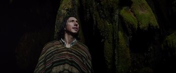 Movie still from “The Man Who Killed Don Quixote” (2018), directed by Terry Gilliam – A man standing next to a tree looking up; Medium shot, Low angle