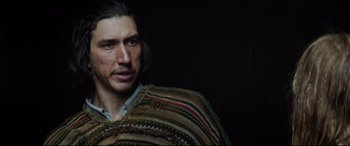 Movie still from “The Man Who Killed Don Quixote” (2018), directed by Terry Gilliam – A person with long black hair; Close Up shot, Over the shoulder angle