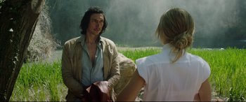 Movie still from “The Man Who Killed Don Quixote” (2018), directed by Terry Gilliam – A man and a woman sitting in a field; Medium shot, Over the shoulder angle