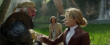 Movie still from “The Man Who Killed Don Quixote” (2018), directed by Terry Gilliam – A man and a woman shaking hands in front of a river; Medium shot, Over the shoulder angle