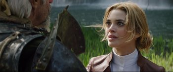 Movie still from “The Man Who Killed Don Quixote” (2018), directed by Terry Gilliam – A woman in a leather jacket looking at a leaf; Close Up shot, Over the shoulder angle