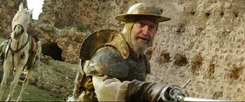 Movie still from “The Man Who Killed Don Quixote” (2018), directed by Terry Gilliam – An old man dressed as a medieval knight; Medium shot, Low angle