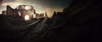 Movie still from “The Man Who Killed Don Quixote” (2018), directed by Terry Gilliam – The sun is setting over a castle on a hill; Extreme Wide shot, Low angle