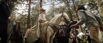 Movie still from “The Man Who Killed Don Quixote” (2018), directed by Terry Gilliam – A woman sitting on top of a white horse; Wide shot, Low angle