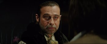 Movie still from “The Man Who Killed Don Quixote” (2018), directed by Terry Gilliam – A person wearing a tie; Close Up shot, Over the shoulder angle