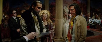 Movie still from “The Man Who Killed Don Quixote” (2018), directed by Terry Gilliam – A group of people dressed in renaissance costumes; Medium shot, Over the shoulder angle