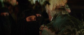 Movie still from “The Man Who Killed Don Quixote” (2018), directed by Terry Gilliam – A woman wearing a black headscarf looking at an older man; Close Up shot, Over the shoulder angle
