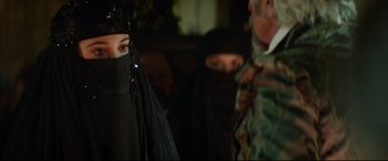 Movie still from “The Man Who Killed Don Quixote” (2018), directed by Terry Gilliam – A woman wearing a black veil in front of a man in a black suit; Close Up shot, Over the shoulder angle