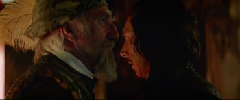 Movie still from “The Man Who Killed Don Quixote” (2018), directed by Terry Gilliam – A man and a woman face to face in a dark room; Close Up shot, Over the shoulder angle