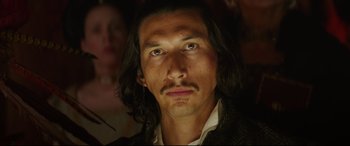 Movie still from “The Man Who Killed Don Quixote” (2018), directed by Terry Gilliam – A person with long black hair; Close Up shot, Low angle
