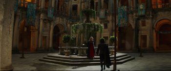 Movie still from “The Man Who Killed Don Quixote” (2018), directed by Terry Gilliam – Two women are standing in front of a fountain; Wide shot, High angle