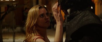 Movie still from “The Man Who Killed Don Quixote” (2018), directed by Terry Gilliam – A beautiful woman touching her hair while standing next to a statue; Close Up shot, Over the shoulder angle