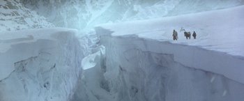 Movie still from “The Man Who Would Be King” (1975), directed by John Huston – A large amount of snow on the ground; Extreme Wide shot, High angle