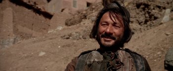 Movie still from “The Man Who Would Be King” (1975), directed by John Huston – A person wearing a helmet; Close Up shot, Low angle