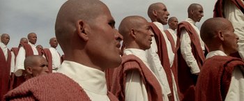 Movie still from “The Man Who Would Be King” (1975), directed by John Huston – A group of men standing next to each other; Close Up shot, Low angle