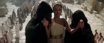 Movie still from “The Man Who Would Be King” (1975), directed by John Huston – A man and a woman dressed in ancient roman clothing; Medium shot, Over the shoulder angle