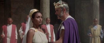 Movie still from “The Man Who Would Be King” (1975), directed by John Huston – A man and a woman in ancient roman garb; Medium shot, Over the shoulder angle