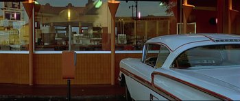 Movie still from “American Graffiti” (1973), directed by George Lucas – Wide shot, Low angle