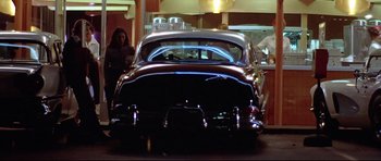 Movie still from “American Graffiti” (1973), directed by George Lucas – Wide shot, Low angle
