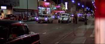 Movie still from “American Graffiti” (1973), directed by George Lucas – Wide shot, Low angle
