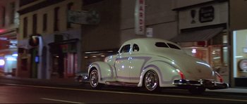 Movie still from “American Graffiti” (1973), directed by George Lucas – Wide shot, Low angle
