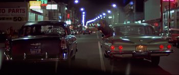 Movie still from “American Graffiti” (1973), directed by George Lucas – Wide shot, Over the shoulder angle