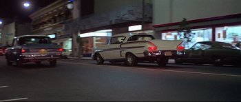 Movie still from “American Graffiti” (1973), directed by George Lucas – Wide shot, Low angle