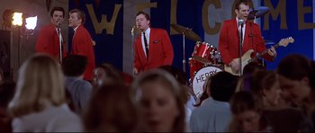 Movie still from “American Graffiti” (1973), directed by George Lucas – Wide shot, Low angle