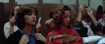 Movie still from “American Graffiti” (1973), directed by George Lucas – Medium shot, Low angle