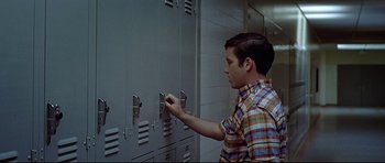 Movie still from “American Graffiti” (1973), directed by George Lucas – Medium shot, Low angle