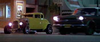 Movie still from “American Graffiti” (1973), directed by George Lucas – Wide shot, Low angle