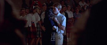 Movie still from “American Graffiti” (1973), directed by George Lucas – Medium shot, Over the shoulder angle