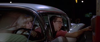 Movie still from “American Graffiti” (1973), directed by George Lucas – Medium shot, Over the shoulder angle