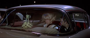 Movie still from “American Graffiti” (1973), directed by George Lucas – Medium shot, Over the shoulder angle