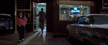 Movie still from “American Graffiti” (1973), directed by George Lucas – Wide shot, Over the shoulder angle