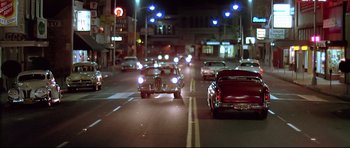 Movie still from “American Graffiti” (1973), directed by George Lucas – Extreme Wide shot, Low angle