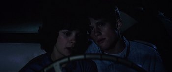 Movie still from “American Graffiti” (1973), directed by George Lucas – Close Up shot, Over the shoulder angle