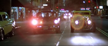 Movie still from “American Graffiti” (1973), directed by George Lucas – Wide shot, Low angle