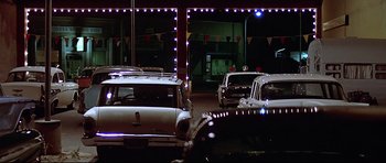 Movie still from “American Graffiti” (1973), directed by George Lucas – Extreme Wide shot, Low angle